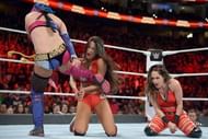 Asuka and Nikki Bella in action
